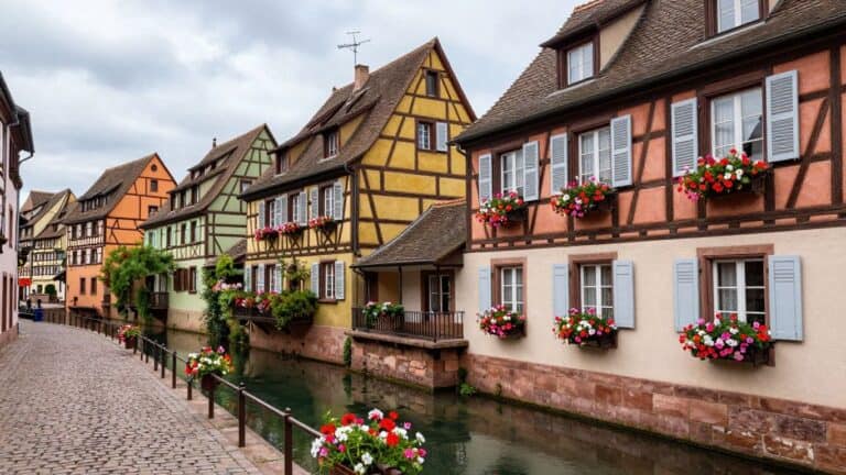 Colorful half-timbered houses along a canal in Colmar, France.