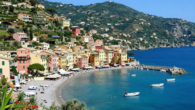 Quiet French Riviera coastal town with colorful buildings and blue sea.