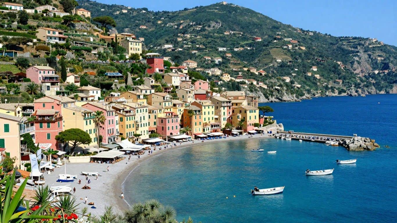Quiet French Riviera coastal town with colorful buildings and blue sea.